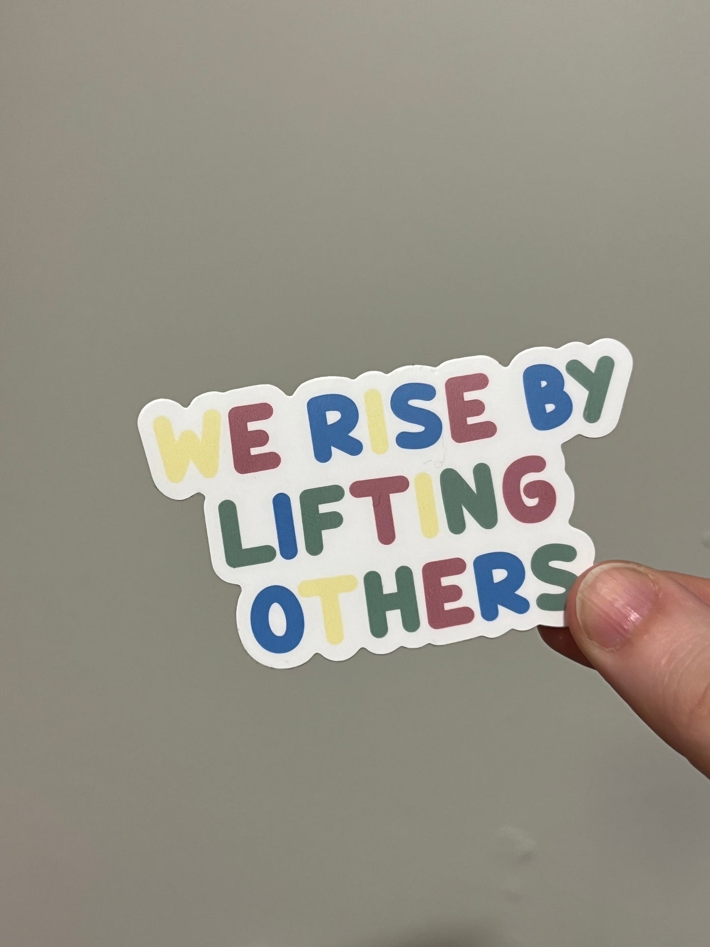 WE RISE sticker